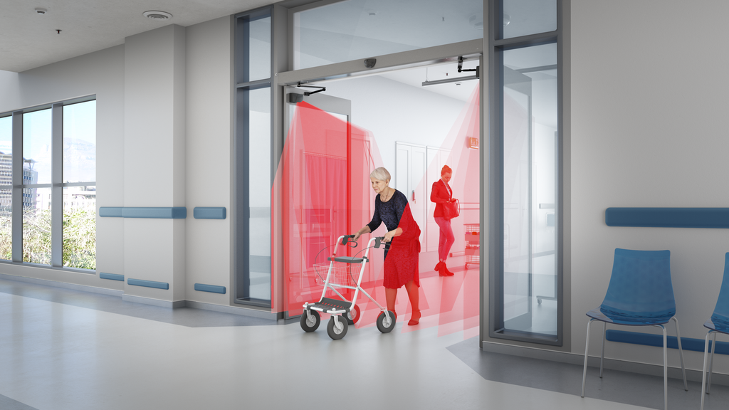 elder people passing through a double swing door